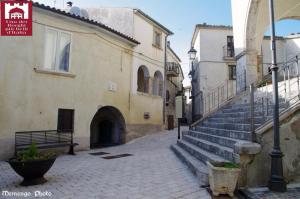 an alley with stairs and a building with a bench at casa vacanza centro storico fornelli in Fornelli