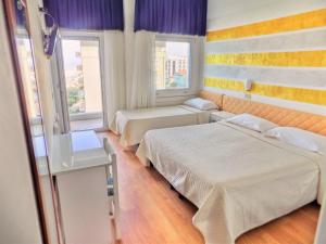 Posteľ alebo postele v izbe v ubytovaní Hotel Diplomatic