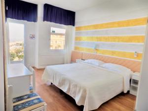 Posteľ alebo postele v izbe v ubytovaní Hotel Diplomatic