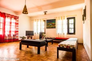 a living room with two beds and a couch at NY Telomiova in Antananarivo