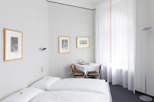 Ein Bett oder Betten in einem Zimmer der Unterkunft Hotel Monte Verità