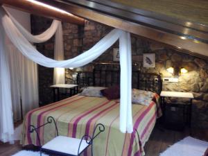 Tempat tidur dalam kamar di Posada Montero de la Concha