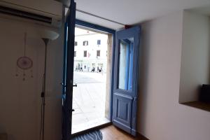 an open door to a hallway with a sidewalk at Apartment Bea with FREE BIKE and BIKE STORAGE in Koper