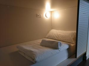 A bed or beds in a room at Agora Hostel