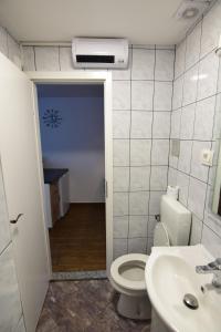 a bathroom with a toilet and a sink at Apartment Bea with FREE BIKE and BIKE STORAGE in Koper +26 photos