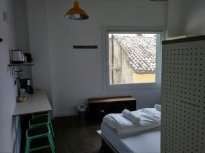 A bed or beds in a room at Agora Hostel
