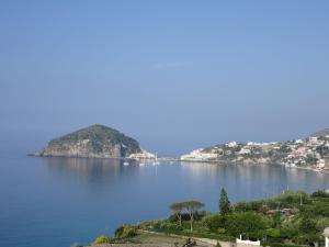 a large body of water with mountains at Casa Antonio in Ischia