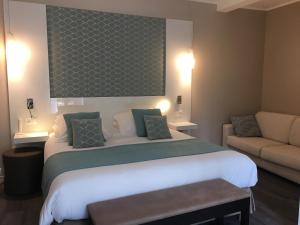 Cama ou camas em um quarto em Hotel Molière