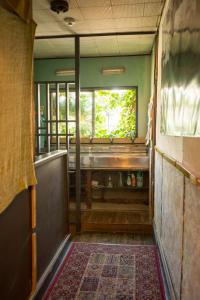 an empty room with a window and a rug at Air Osaka Hostel in Osaka +71 photos