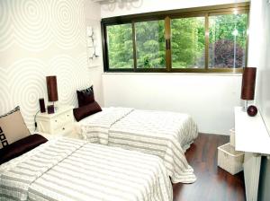 A bed or beds in a room at Hotel Escuela Madrid