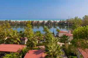 a view of a large body of water with palm trees at Village Lake Placid in Silvi Marina