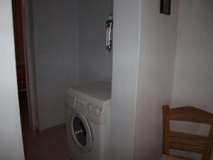 a washer and dryer in a corner of a room at Alatsaria House in Cherronisos