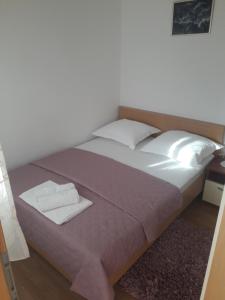 Postel nebo postele na pokoji v ubytování Apartments Šime