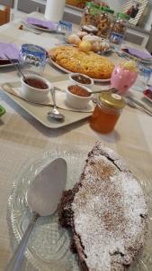 a table with a piece of cake on a plate at B&B Anny in Porto Garibaldi