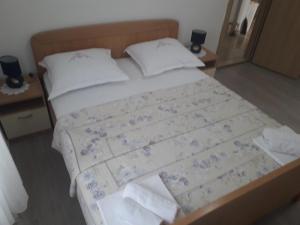 Postel nebo postele na pokoji v ubytování Apartments Šime