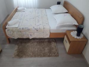 Postel nebo postele na pokoji v ubytování Apartments Šime