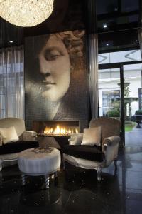 a living room with a couch and a fireplace at Maison Albar - Le Diamond in Paris