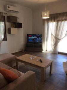 TV a/nebo společenská místnost v ubytování house chaido