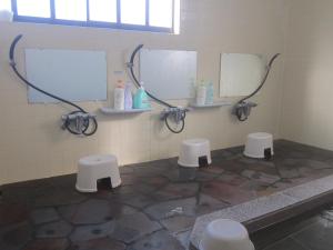 a bathroom with two sinks and two mirrors at Bamboo-Hill -OT- in Nozawa Onsen +32 photos