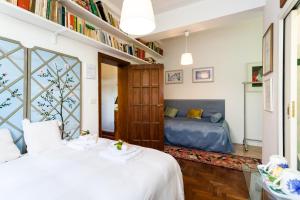 Кровать или кровати в номере Casa Disma Urbino