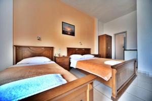 Voodi või voodid majutusasutuse Hotel Jason toas