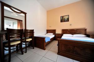 Voodi või voodid majutusasutuse Hotel Jason toas