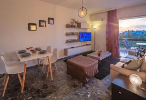 Televízia a/alebo spoločenská miestnosť v ubytovaní Archer - Sea view apartment
