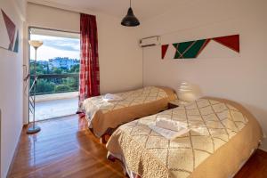 Posteľ alebo postele v izbe v ubytovaní Archer - Sea view apartment