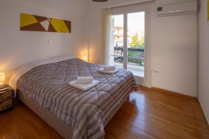 Posteľ alebo postele v izbe v ubytovaní Archer - Sea view apartment