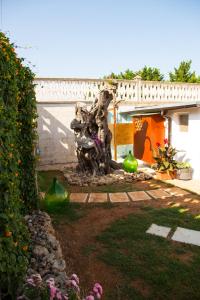 a statue of a bear sitting in a yard at Chalet Gallipoli in Gallipoli