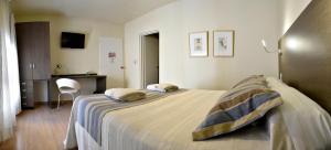 Cama ou camas em um quarto em Abril Hotel Boutique