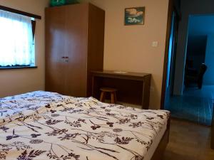 Postel nebo postele na pokoji v ubytování Apartments Markelj