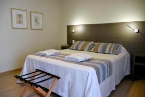 Cama ou camas em um quarto em Abril Hotel Boutique