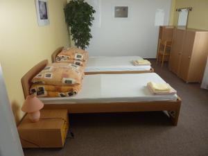 Posteľ alebo postele v izbe v ubytovaní Hotelový Dům