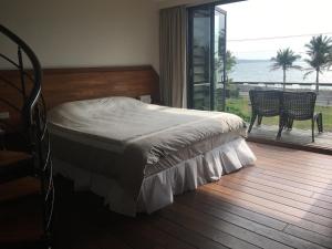 Postel nebo postele na pokoji v ubytování Coconut Beach Homestay