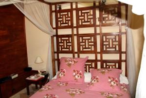 Un pat sau paturi într-o cameră la Matilona