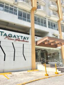 a building with a takeaway sign on the side of it at Sofia's Tagaytay Getaway in Tagaytay