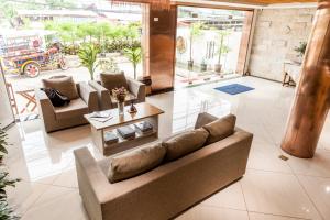 a living room with a couch and a table at Central Boutique Hotel in Vientiane