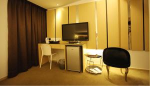 Kuchyň nebo kuchyňský kout v ubytování Meng Qi Hotel