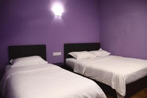 Postel nebo postele na pokoji v ubytování Hotel Sri Rembia + 9 fotografií