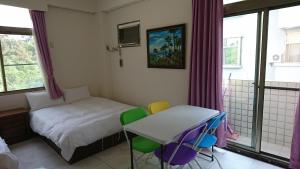 Postel nebo postele na pokoji v ubytování Garden Hostel
