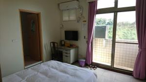 Postel nebo postele na pokoji v ubytování Garden Hostel