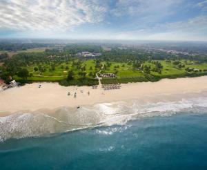 an aerial view of a beach with a group of people at Taj Exotica Resort & Spa, Goa in Benaulim