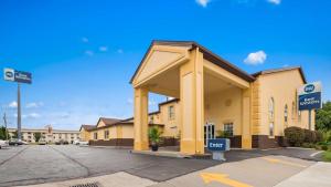 a building with a for sale sign in a parking lot at Best Western Elyria in Elyria