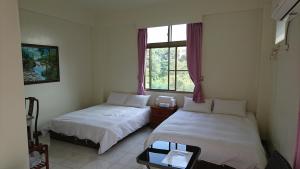 Postel nebo postele na pokoji v ubytování Garden Hostel