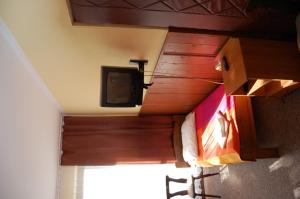 Televízia a/alebo spoločenská miestnosť v ubytovaní Hotel Bona