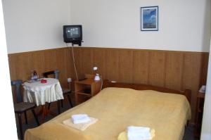 Posteľ alebo postele v izbe v ubytovaní Hotel Bona