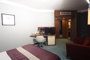 A television and/or entertainment centre at Suhan Cappadocia Hotel & Spa