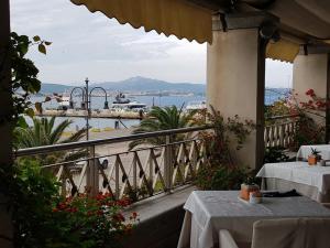 a view from a balcony overlooking the ocean at Excelsior in La Maddalena