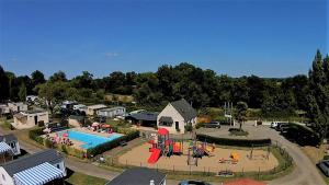 an aerial view of a park with a pool and playground at camping Le Kermadec in Ambon